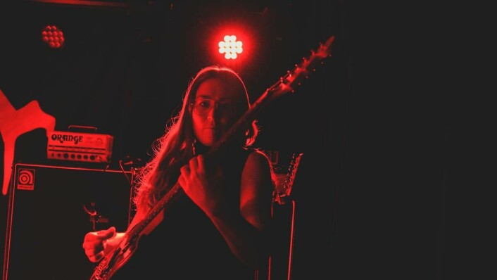 Rikke Karlsen plays guitar in the Norwegian Doom Metal band Dwaal.