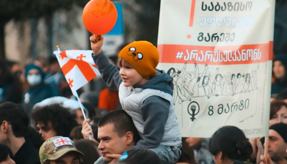 Text on the banner from up to down: “Women are left without basic rights! #nototherussianlaw. 8th of March.” Mass Protests in Tbilisi, Georgia during March 2023.