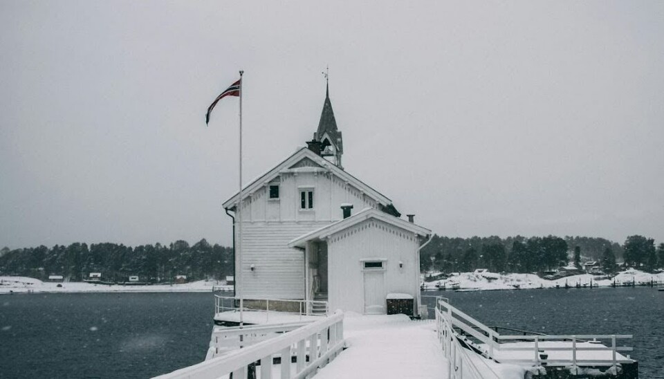 White lighthouse on Gressholmen island in Oslo.